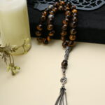 A distinctive 33-bead Honey Tiger Eye stone rosary.