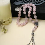 A 33-bead rosary made of natural Rose Quartz.