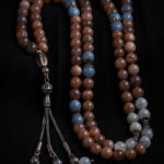 Rosary made of sunstone inlaid with aquamarine moonstones.